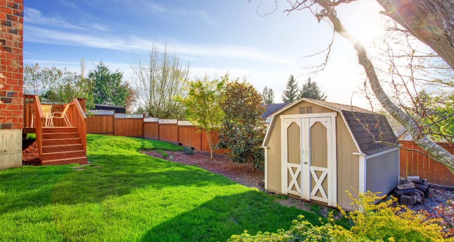 Fenced backyard with storage shed in Santa Fe